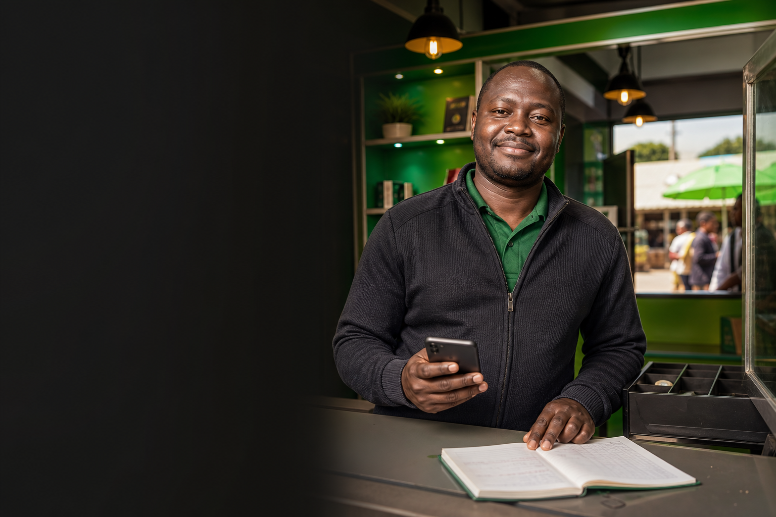Kenyan mobile-money shop operator ready to serve customers